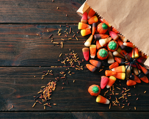 Photo of a brown bag filled with Halloween candy